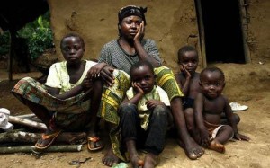 A wake for the loss of her husband. She is with her children and she has no help Grand Kasai, Congo